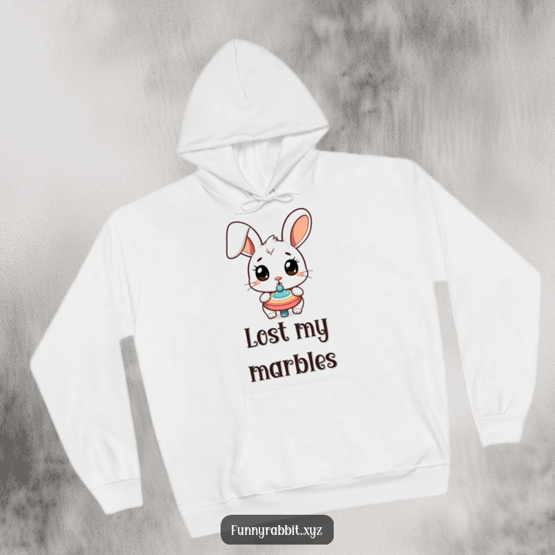 Funny surprised rabbit hoodie featuring a cartoon bunny with wide eyes, captivated by a spinning top, offering a humorous and cozy vibe.